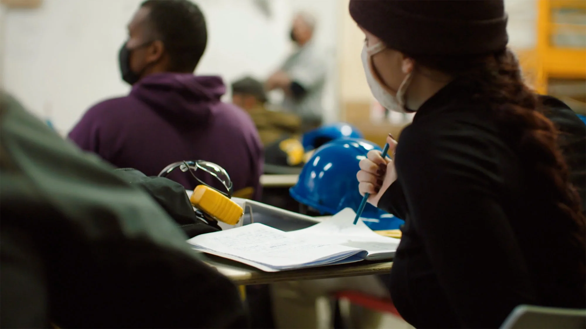Woman taking builders classes in classroom